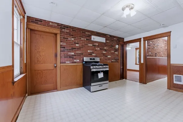 a kitchen with stainless steel appliances granite countertop a refrigerator and a stove