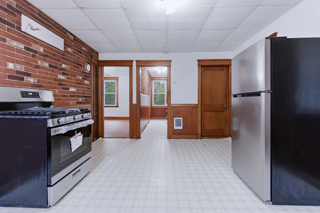 7 3rd Avenue Dudley, MA 01571 - Photo 17 of 42 a kitchen with stainless steel appliances granite countertop a refrigerator and a stove
