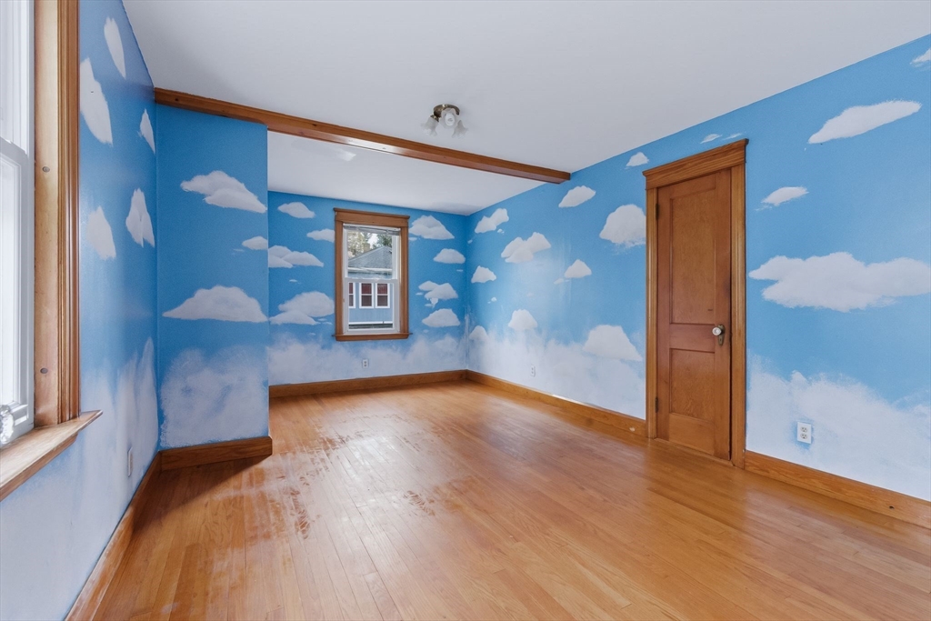 7 3rd Avenue Dudley, MA 01571 - Photo 18 of 42 a view of a hallway with wooden floor and cabinet