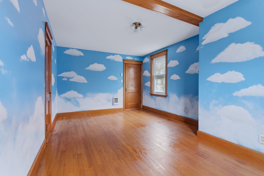 7 3rd Avenue Dudley, MA 01571 - Photo 19 of 42 a view of an empty room with wooden floor