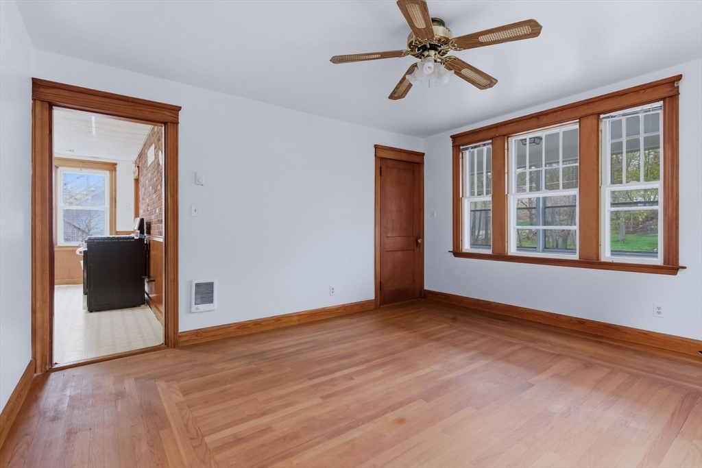 7 3rd Avenue Dudley, MA 01571 - Photo 22 of 42 wooden floor in an empty room with a window