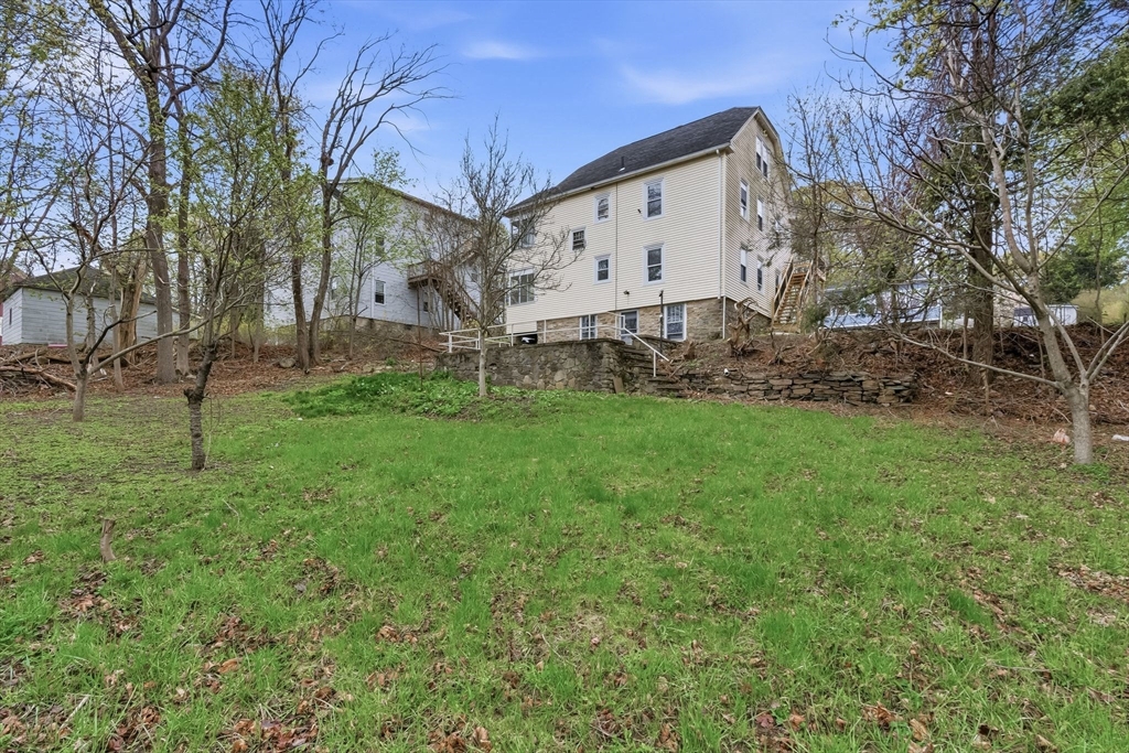 7 3rd Avenue Dudley, MA 01571 - Photo 36 of 42 a view of a house with a yard
