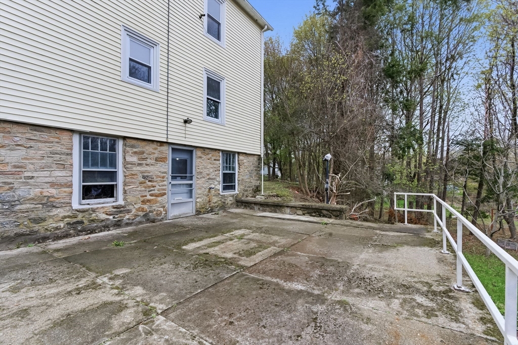 7 3rd Avenue Dudley, MA 01571 - Photo 37 of 42 a view of a house with backyard and parking