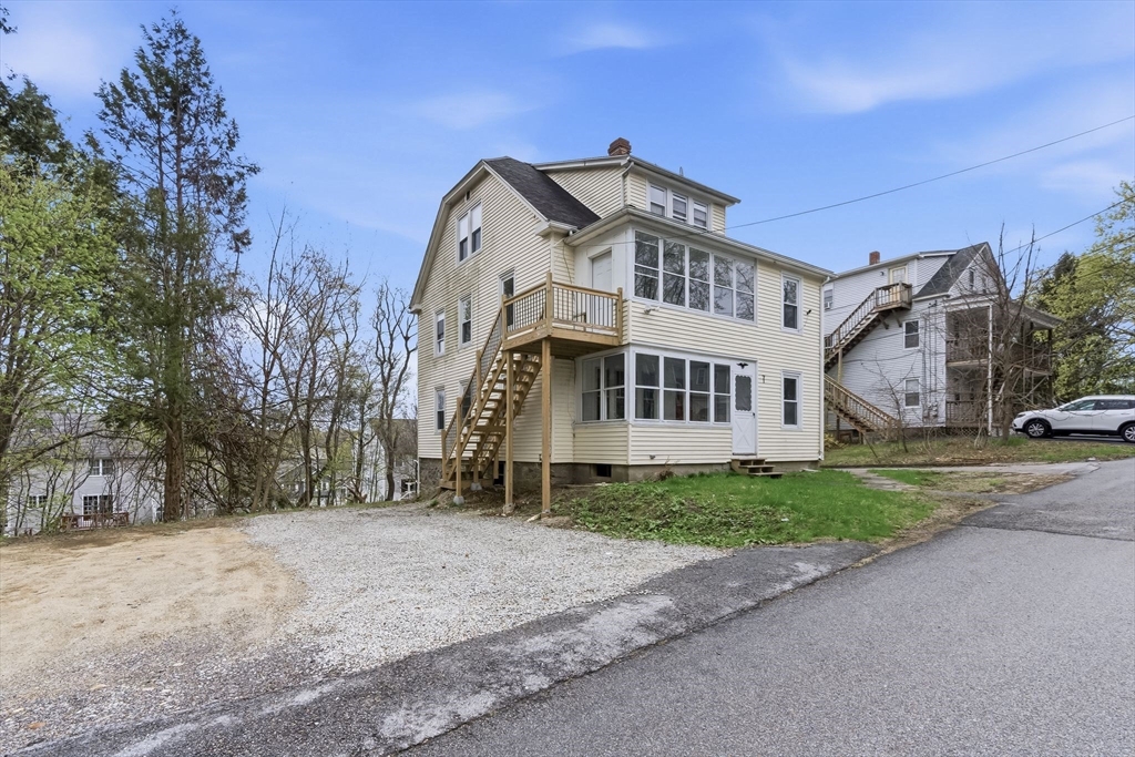 7 3rd Avenue Dudley, MA 01571 - Photo 39 of 42 a front view of a house with a yard