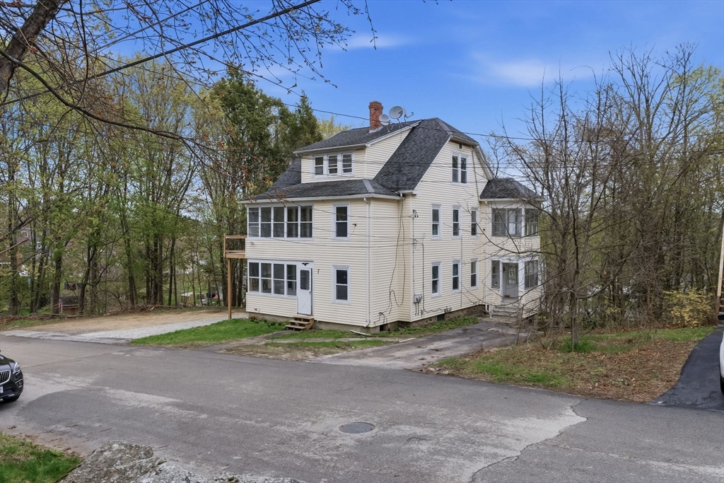 7 3rd Avenue Dudley, MA 01571 - Photo 40 of 42 a front view of a house with a garden
