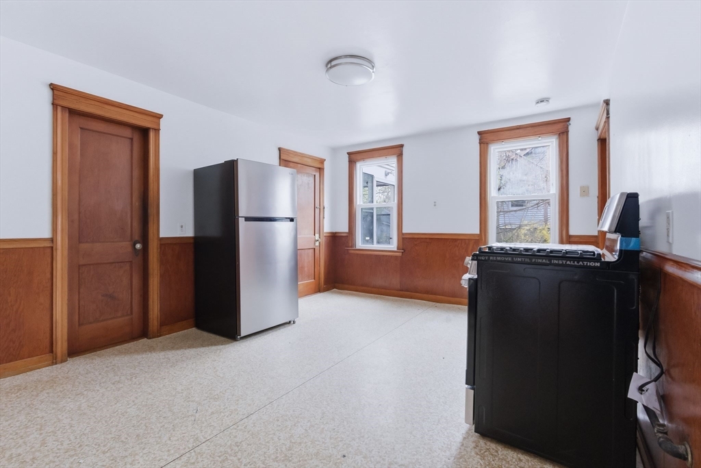 7 3rd Avenue Dudley, MA 01571 - Photo 8 of 42 a view of kitchen with stainless steel appliances granite countertop cabinets and a refrigerator
