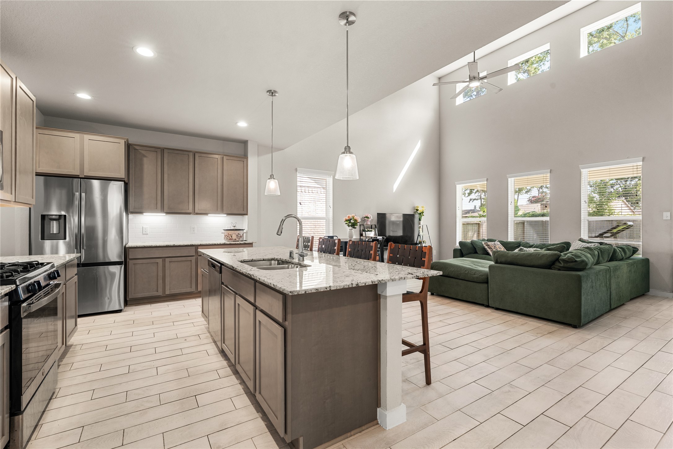 22939 Aspen Vista Dr Spring Spring, TX 77373 - Photo 8 of 29 The open concept design allows the kitchen to flow effortlessly into the family room, creating a space that's perfect for entertaining, everyday living, and staying connected.