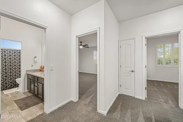 a view of a kitchen and an empty room