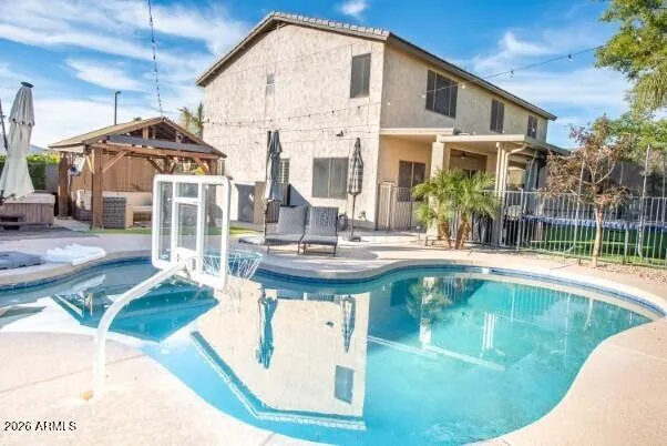 a view of a porch with wooden floor and a sink