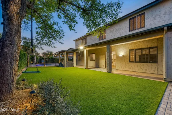 a view of an house with backyard space and garden