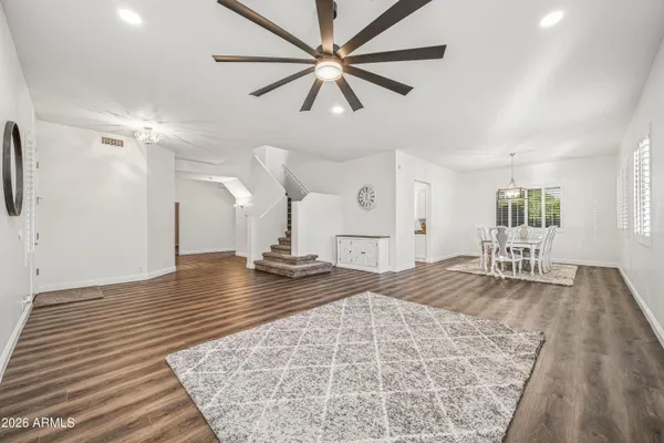 a view of empty room with wooden floor