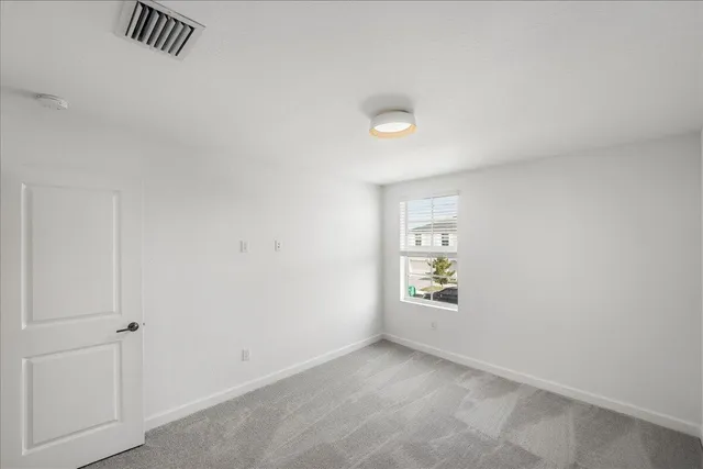 a view of yellow house with a swimming pool