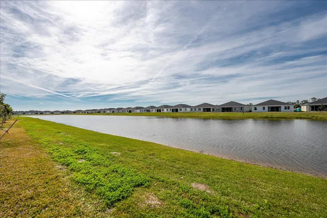 a view of swimming pool with outdoor seating and yard