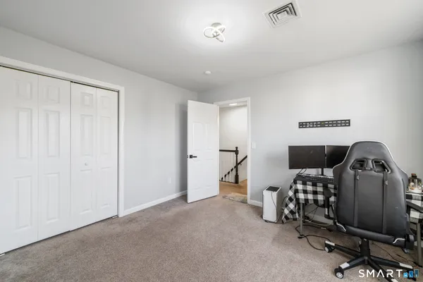 a bedroom with furniture and natural light