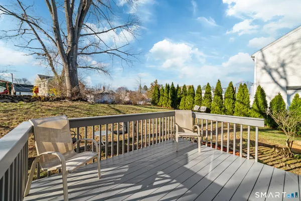 a view of wooden deck and a patio