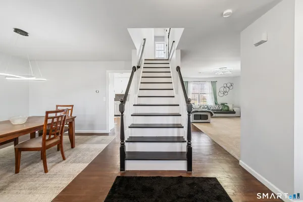 a view of a hallway with seating space