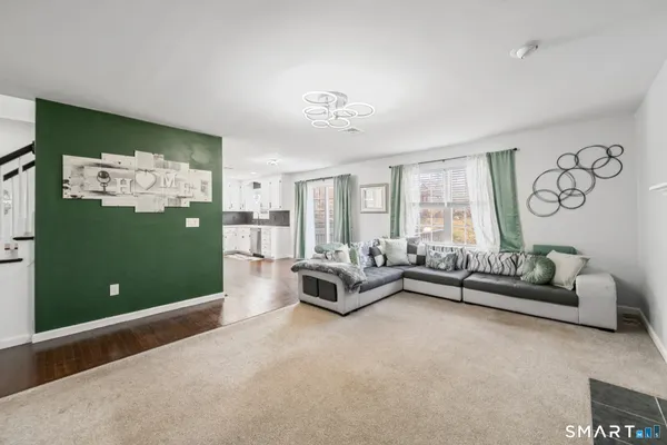 a living room with furniture and a large window