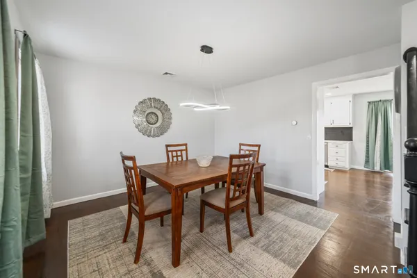 a view of a dining room with furniture