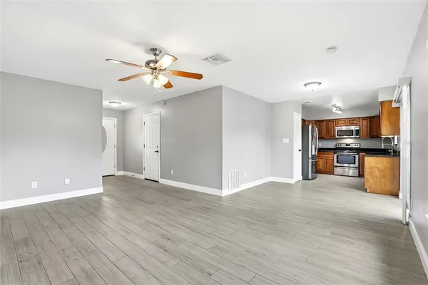 a view of kitchen with wooden floor and window