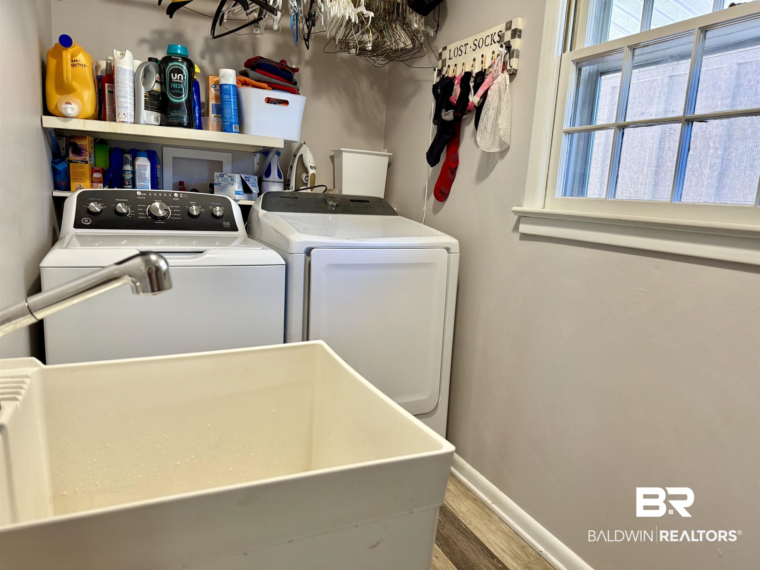 2785 Appleton Road Brewton, AL 36426 - Photo 21 of 28 Washroom with washer and dryer and wood finished floors