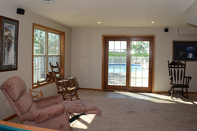 16732 Trask Bridge Road Pecatonica, IL 61063 - Photo 12 of 17 a living room with furniture windows and a flat screen tv