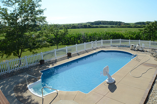 16732 Trask Bridge Road Pecatonica, IL 61063 - Photo 3 of 17 a view of a roof deck with couches and wooden fence