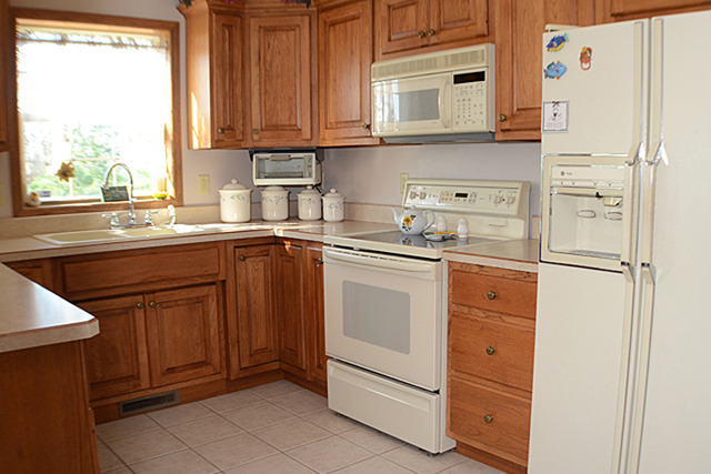16732 Trask Bridge Road Pecatonica, IL 61063 - Photo 6 of 17 a kitchen with stainless steel appliances granite countertop cabinets and window