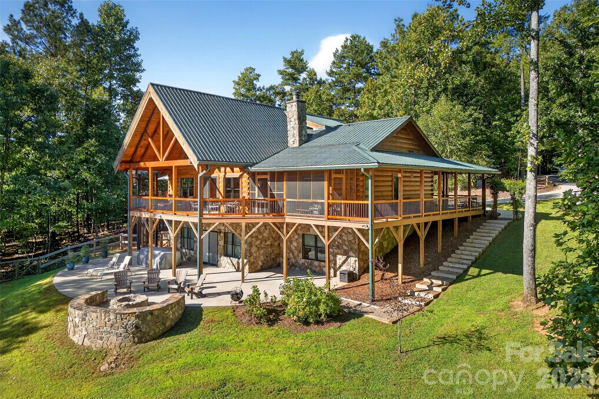 61 Majestic Path Nebo, NC 28761 - Photo 1 of 48 a house with swimming pool in front of it