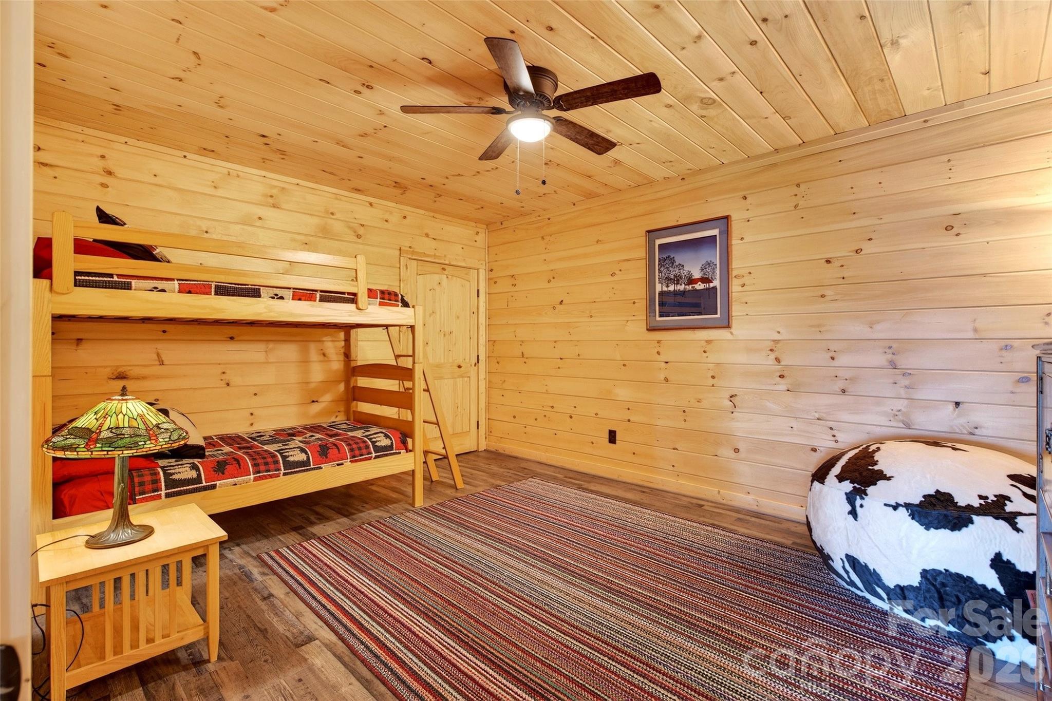 61 Majestic Path Nebo, NC 28761 - Photo 26 of 48 a bedroom with a bed and wooden floor