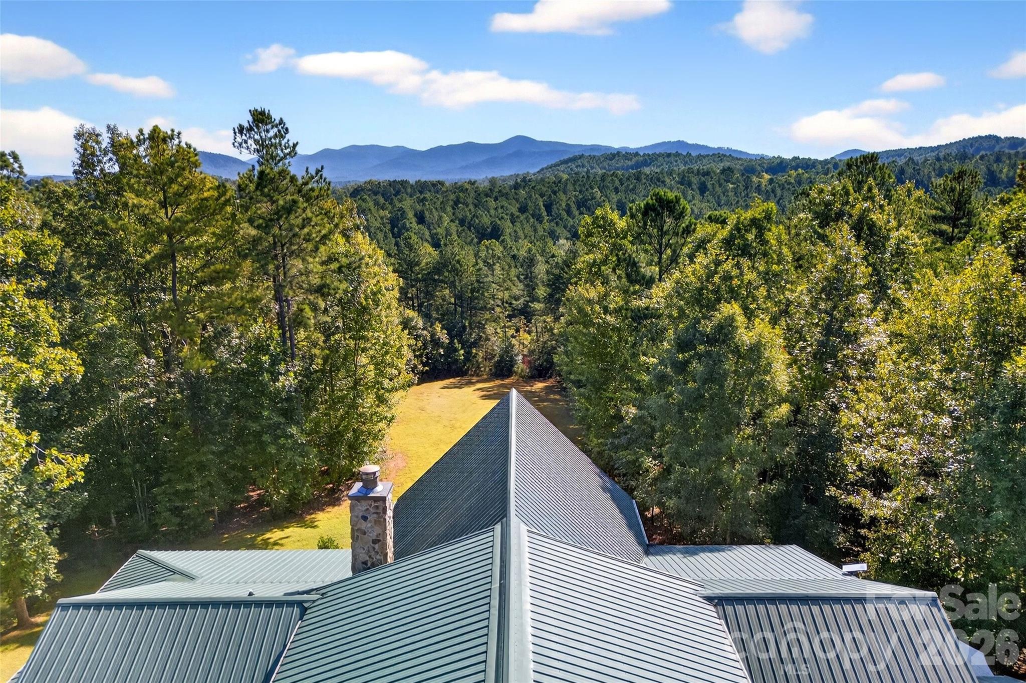 61 Majestic Path Nebo, NC 28761 - Photo 8 of 48 a view of a balcony with an outdoor seating and a yard