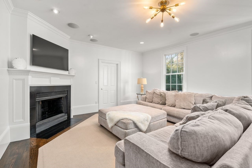 22 Plymouth Road Wellesley, MA 02481 - Photo 14 of 37 a living room with furniture and a fireplace