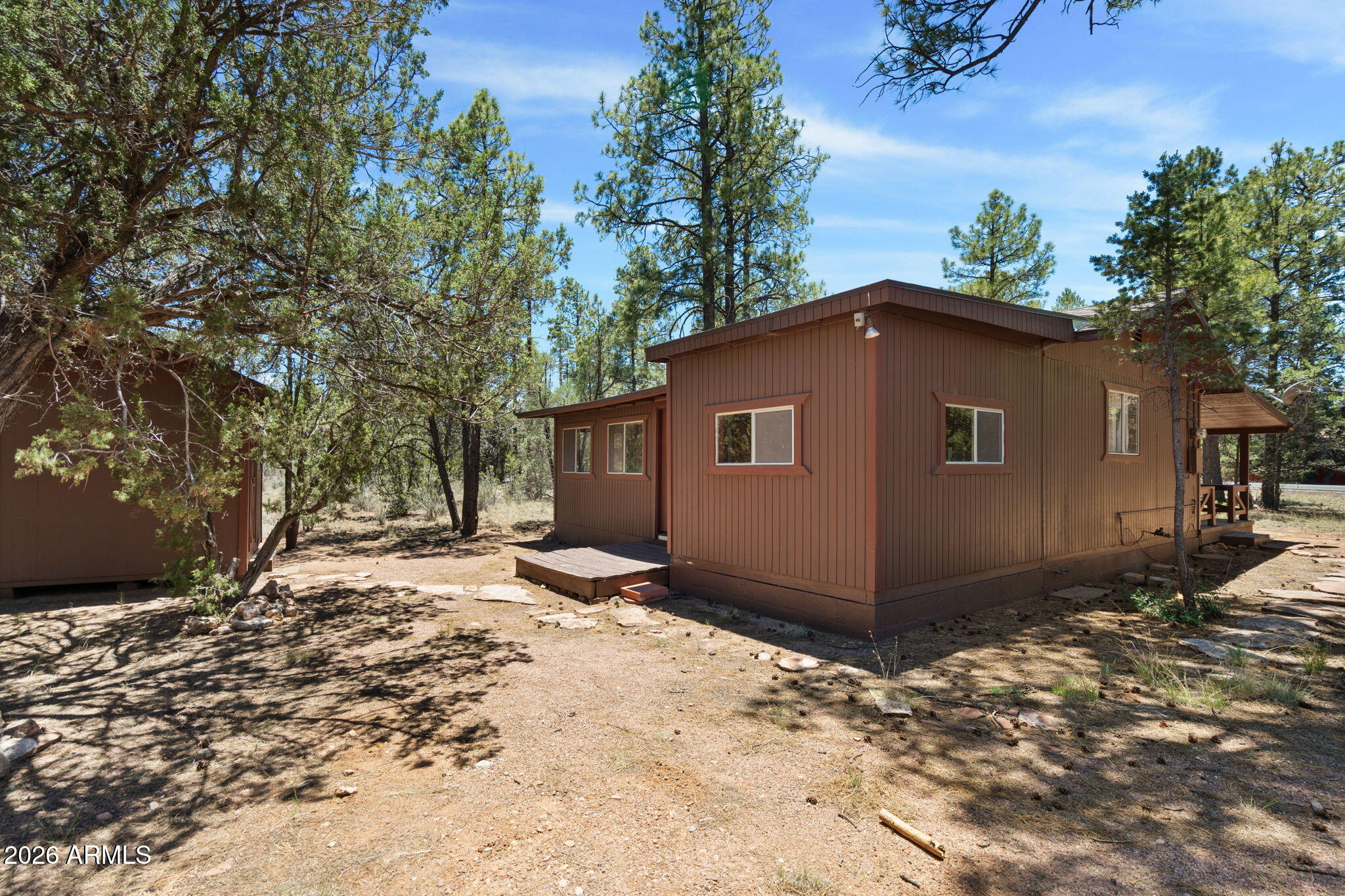 2943 Buckskin Road Overgaard, AZ 85933 - Photo 33 of 36 a view of a house with a yard