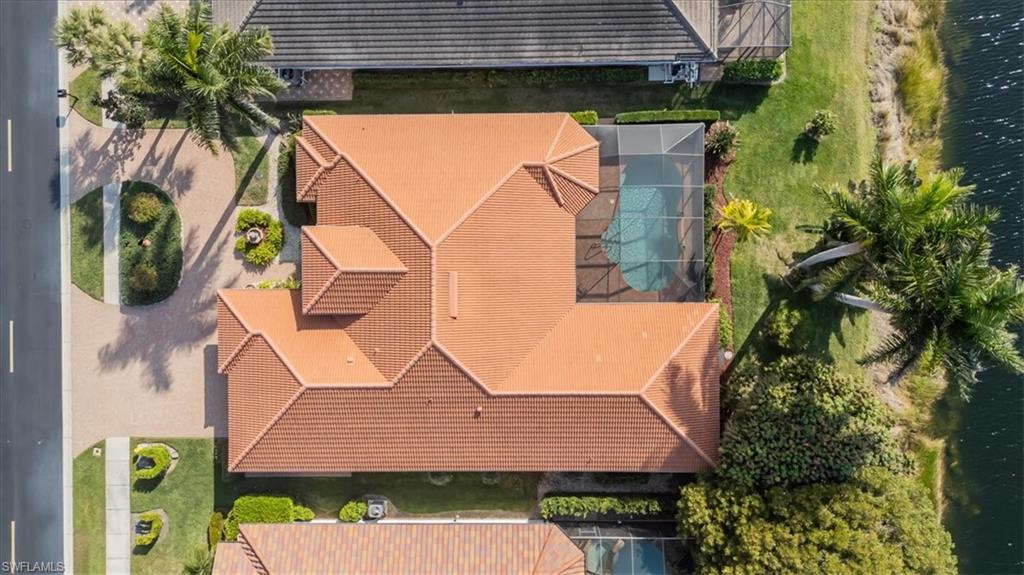 4971 Rustic Oaks Circle Naples, FL 34105 - Photo 2 of 50 an aerial view of a house with swimming pool and porch