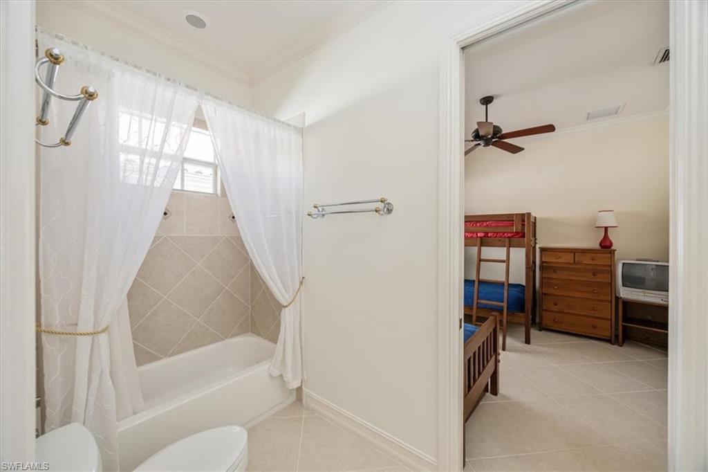 4971 Rustic Oaks Circle Naples, FL 34105 - Photo 34 of 50 a bathroom with a tub and a shower