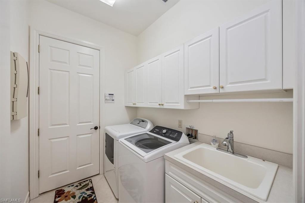4971 Rustic Oaks Circle Naples, FL 34105 - Photo 36 of 50 a view of storage and utility room with washer and dryer