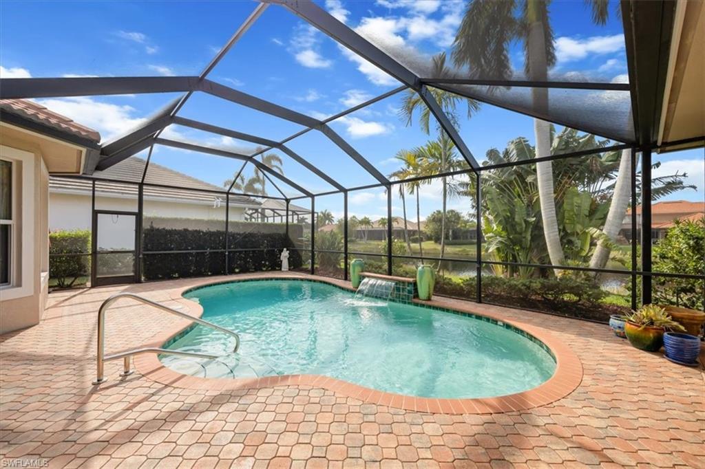 4971 Rustic Oaks Circle Naples, FL 34105 - Photo 40 of 50 a indoor swimming pool with barbeque outdoor seating