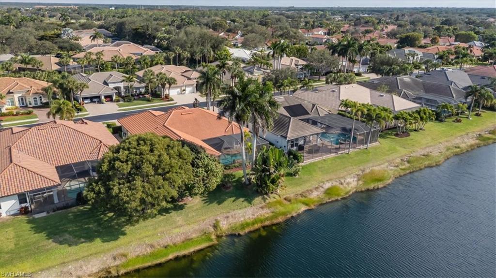 4971 Rustic Oaks Circle Naples, FL 34105 - Photo 42 of 50 an aerial view of residential houses with outdoor space and swimming pool