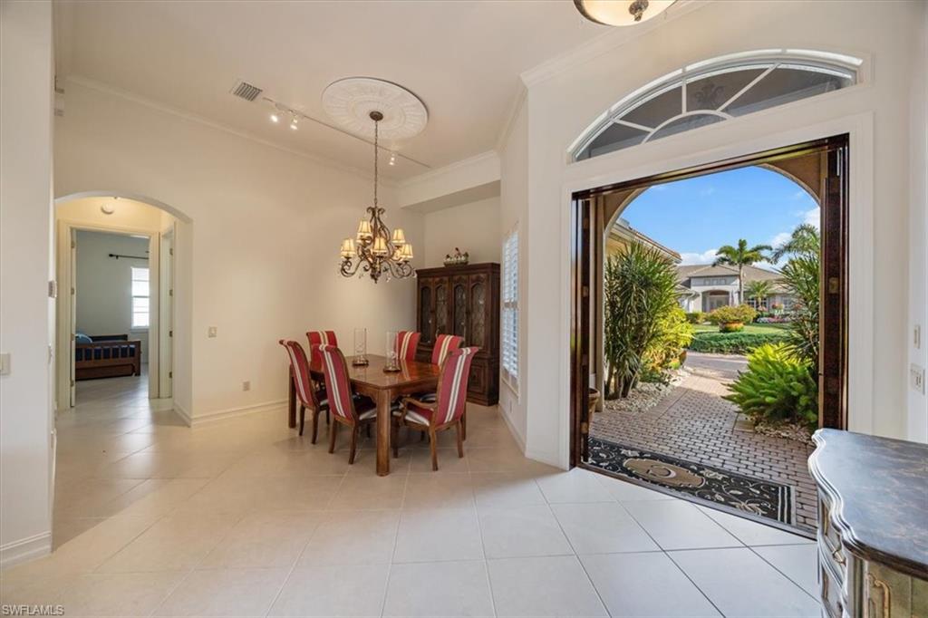 4971 Rustic Oaks Circle Naples, FL 34105 - Photo 6 of 50 a view of a dining room with furniture window and outside view