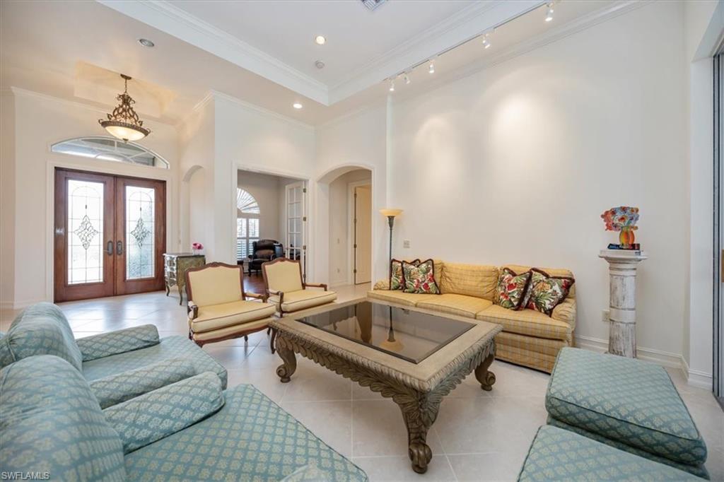 4971 Rustic Oaks Circle Naples, FL 34105 - Photo 8 of 50 a living room with furniture and wooden floor