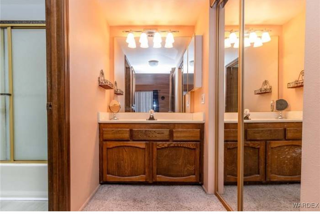 1190 Ramar Road, Unit 15 Bullhead City, AZ 86442 - Photo 13 of 17 Full bathroom with vanity and baseboards