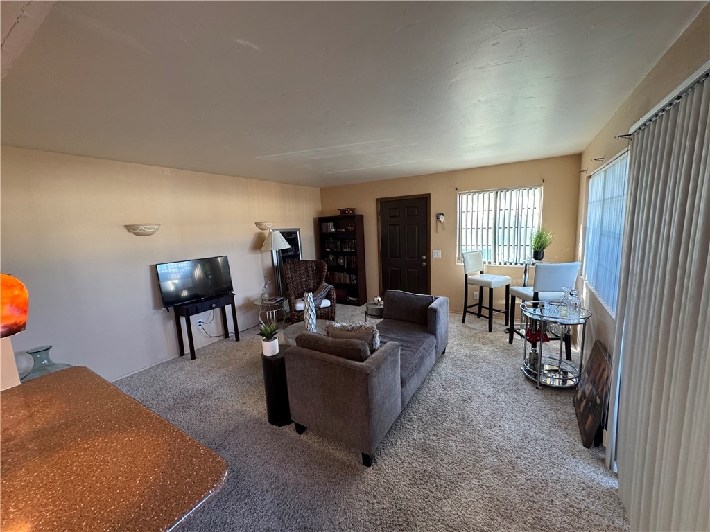1190 Ramar Road, Unit 15 Bullhead City, AZ 86442 - Photo 3 of 17 Living room with carpet floors