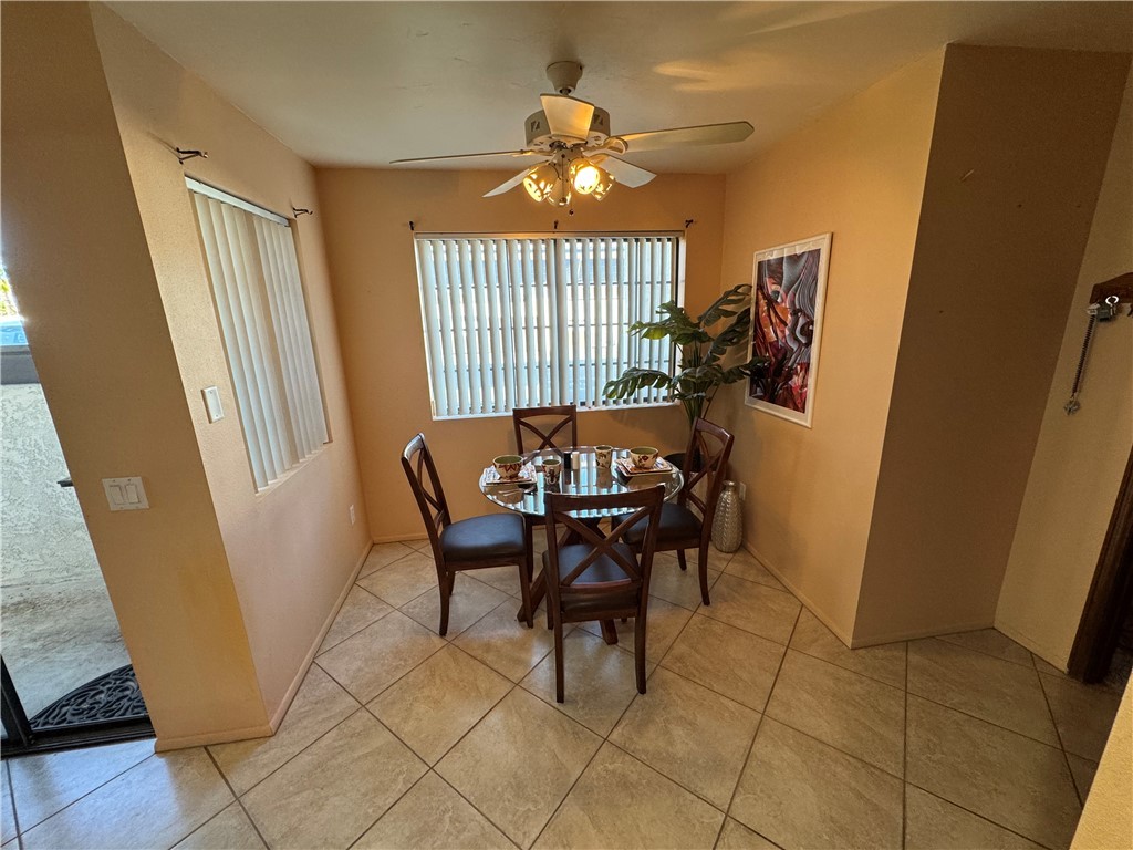 1190 Ramar Road, Unit 15 Bullhead City, AZ 86442 - Photo 6 of 17 Dining space with light tile patterned floors and a ceiling fan