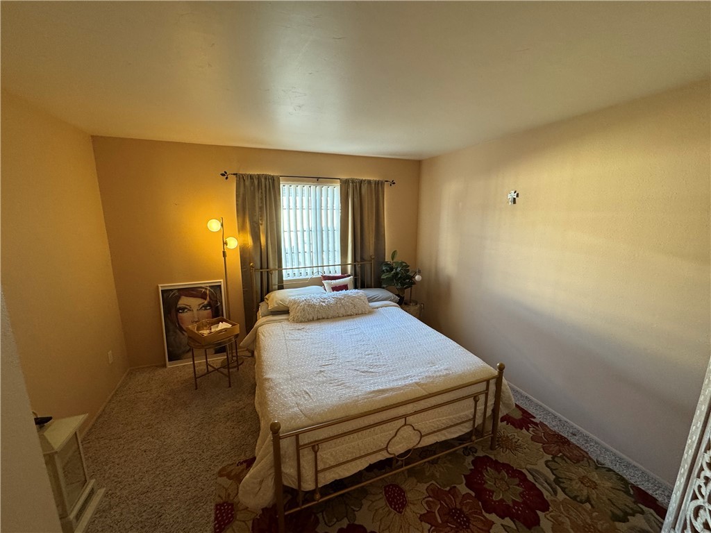 1190 Ramar Road, Unit 15 Bullhead City, AZ 86442 - Photo 8 of 17 Carpeted bedroom featuring baseboards
