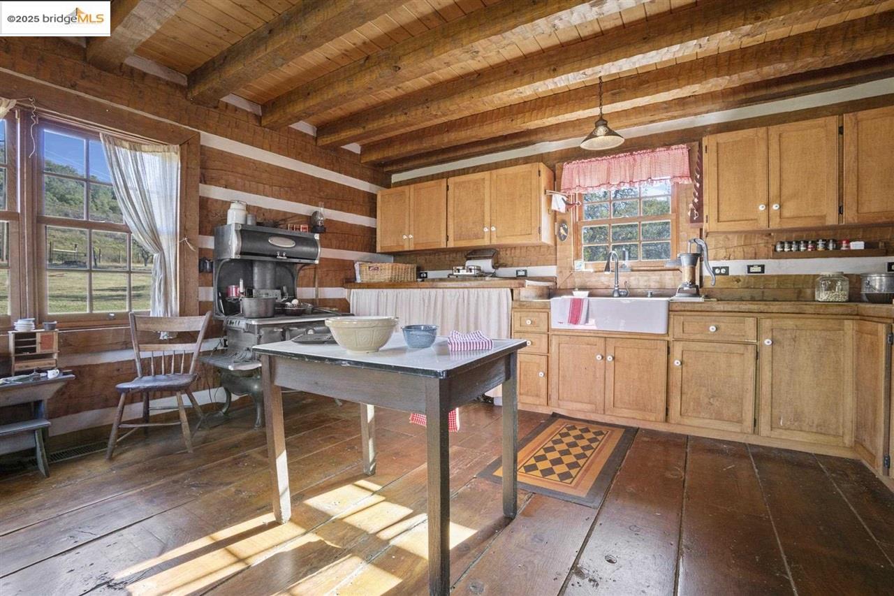 16101 Moccasin Ranch Road Coulterville, CA 95311 - Photo 19 of 60 a open kitchen with lots of counter furniture a sink and appliances