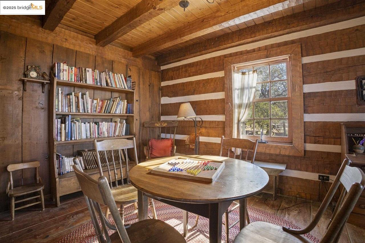 16101 Moccasin Ranch Road Coulterville, CA 95311 - Photo 24 of 60 a view of a dining room with furniture and a large window