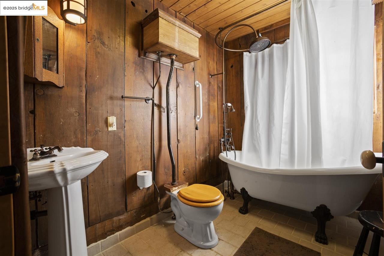 16101 Moccasin Ranch Road Coulterville, CA 95311 - Photo 28 of 60 a bathroom with a sink toilet and shower