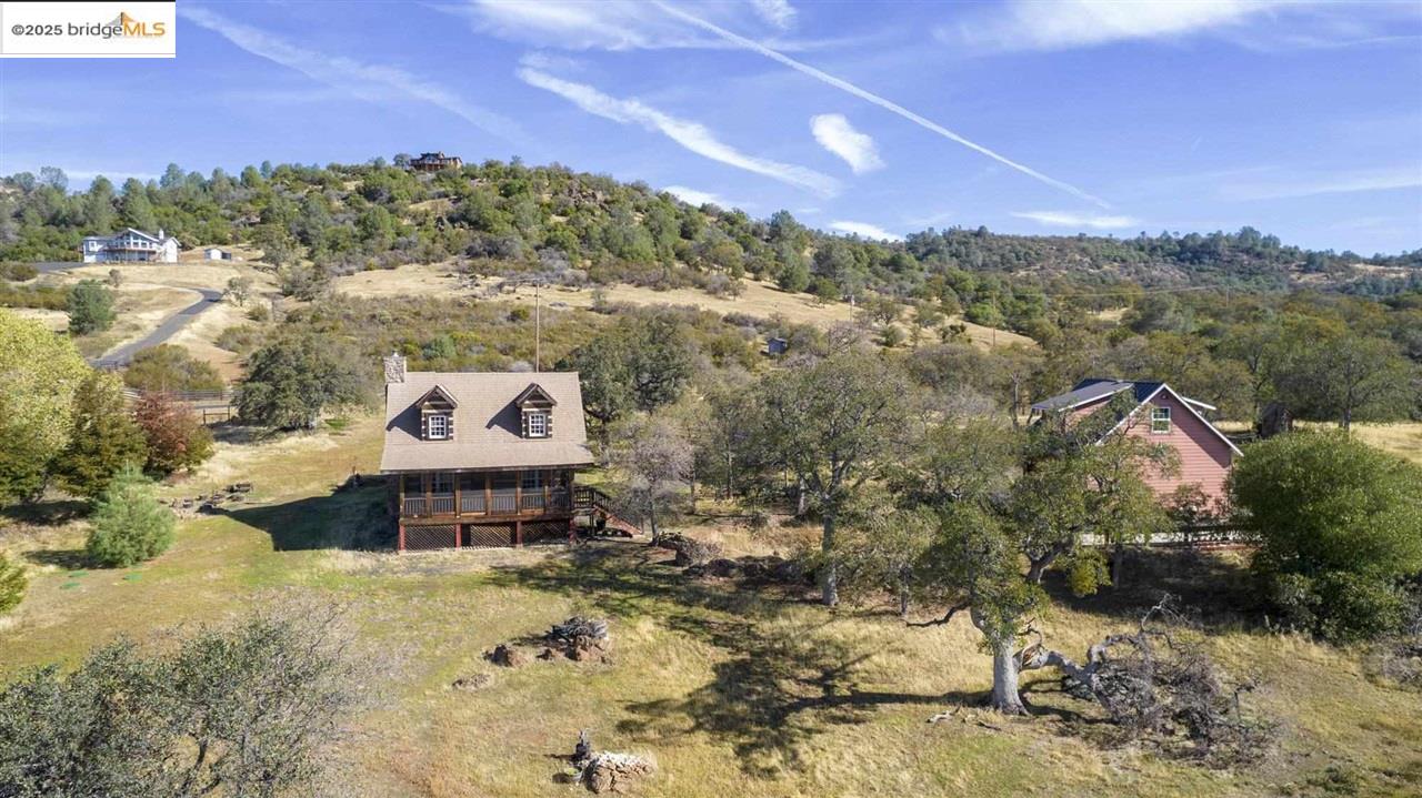 16101 Moccasin Ranch Road Coulterville, CA 95311 - Photo 41 of 60 a view of a house with a yard