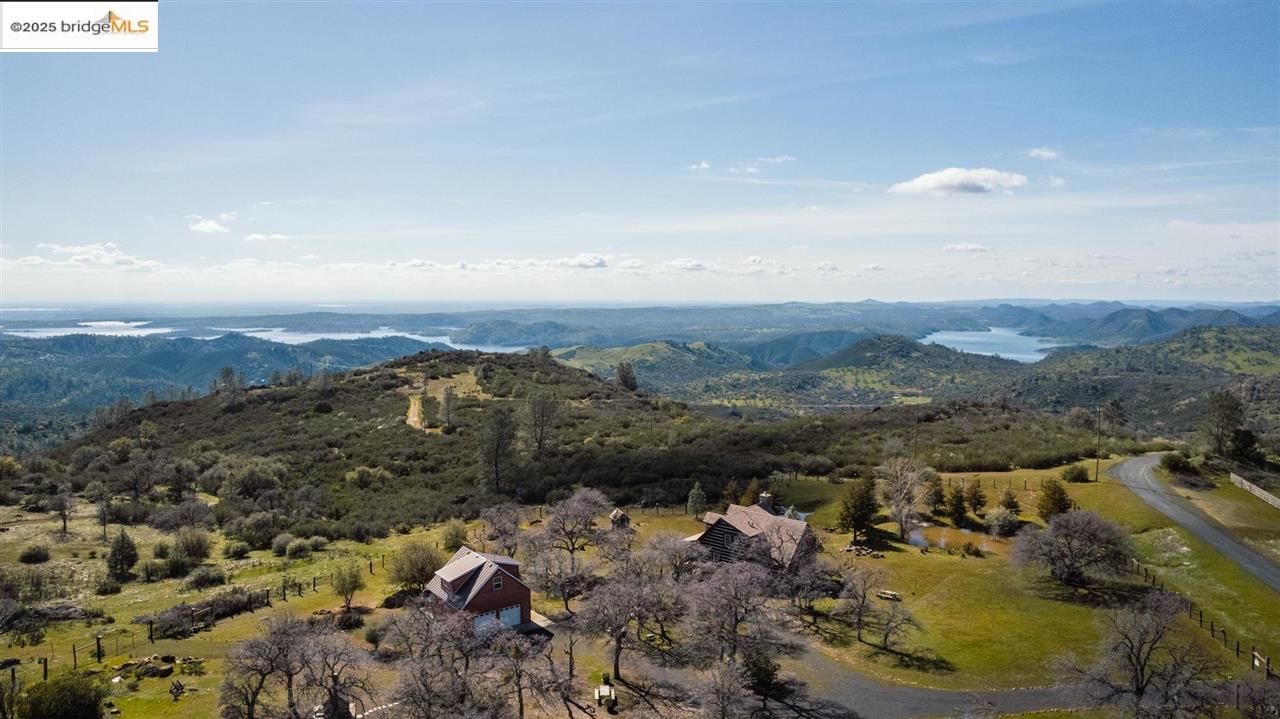 16101 Moccasin Ranch Road Coulterville, CA 95311 - Photo 47 of 60 an aerial view of a house with a mountain