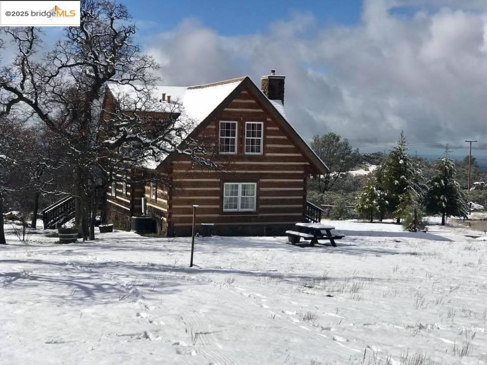 16101 Moccasin Ranch Road Coulterville, CA 95311 - Photo 7 of 60 a view of house with snow on the road