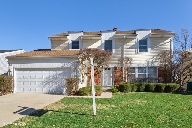 1203 Devonshire Road Buffalo Grove, IL 60089 - Photo 1 of 1 a view of a building with a yard